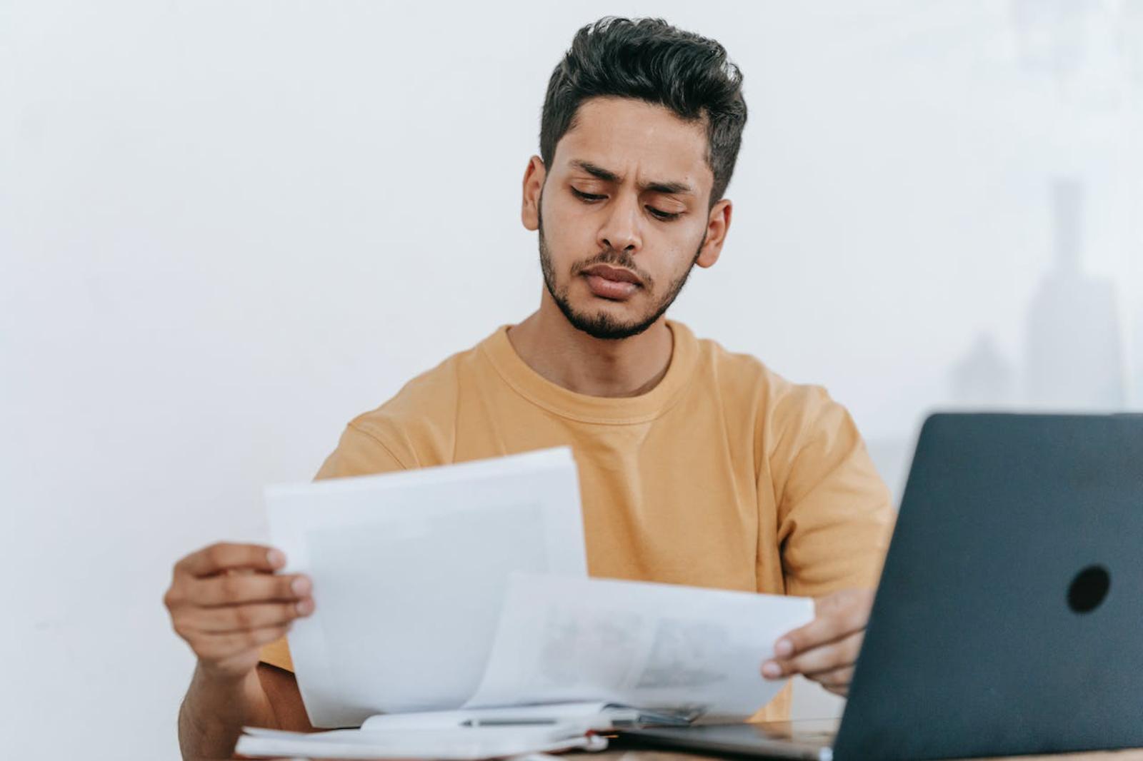 Man considering paperwork